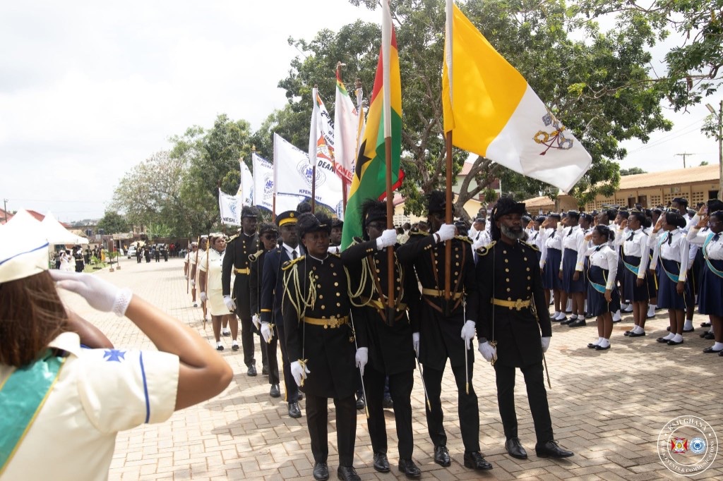 KSJI Ghana flag procession with Ghana and Vatican flags
